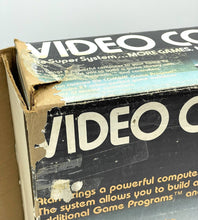 Load image into Gallery viewer, Atari VCS 2600 Woody console box back view with game graphics.