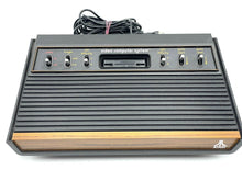 Load image into Gallery viewer, Atari VCS 2600 Woody console rear view showing cable connections and ventilation slots.