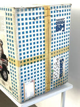 Load image into Gallery viewer, Side view of the packaging box displaying the original 1980s design.