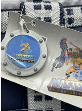 Load image into Gallery viewer, Detail of the keychain with logo featuring a circular design in blue and silver.