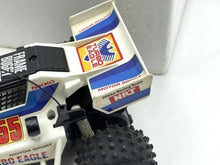 Load image into Gallery viewer, Detailed view of the remote control car's body and tires.