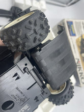 Load image into Gallery viewer, Close-up of the Nikko Black Cat Laser 4WD tire with detailed texture.