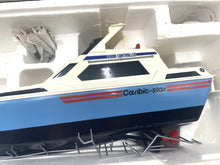 Load image into Gallery viewer, Close-up of the Vintage Nikko Caribic Star Speed Cruiser model with detailed design in a display case.