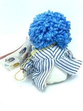 Carica l'immagine nel visualizzatore di Gallery, Back view of the Patapouf New Girl doll showing blue curly hair and striped dress.