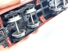 Load image into Gallery viewer, Marklin H0 - 4626 close-up detail of black and silver train car wheels with visible axles.