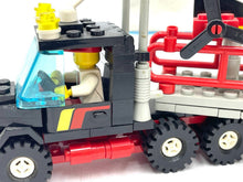 Load image into Gallery viewer, Detail view of the LEGO truck's cargo area with propeller and cargo rack.