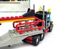Load image into Gallery viewer, Side view of the red LEGO helicopter highlighting rotor blades and trailer attachment.