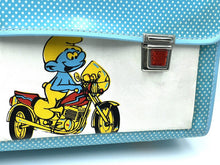 Load image into Gallery viewer, Smurfs Official close-up detail of the blue cartoon school bag showcasing the metal clasp.