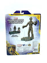 Load image into Gallery viewer, Back view of Marvel Groot Action Figure in packaging, showcasing Marvel branding.