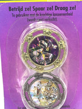 Load image into Gallery viewer, Packaging view of the 1993 Bandai Mighty Morphin Power Rangers Spin Fighters showing two spinning tops in purple and black.