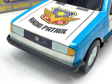 Load image into Gallery viewer, JUGUETES ROMAN COCHE ELECTRICO POLICE CAR front detail view highlighting the police badge and grille.
