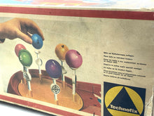 Load image into Gallery viewer, Top view of the game box displaying colorful balloons and printed text.