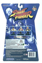 Load image into Gallery viewer, STREET FIGHTER - KEN Player 2 Jazwares 15th Anniversary back view of packaging showing character lineup and product details.