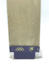 Load image into Gallery viewer, VINTAGE ARCO OLYMPIA OLIMPIADI ARCOFALC Frecce Set bottom view of packaging with beige and blue colors.