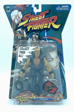 Load image into Gallery viewer, Front view of the sealed Street Fighter Akuma Player 2 figure in blister packaging.