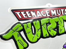Load image into Gallery viewer, Close-up of the Teenage Mutant Ninja Turtles logo in cartoon style.