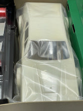 Load image into Gallery viewer, Detail view of BMW M1 model car parts in original packaging.
