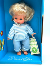Load image into Gallery viewer, Close-up of Furga Tino Ride's face details highlighting blue eyes and smiling expression.