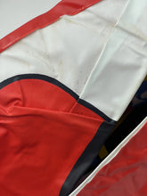 Load image into Gallery viewer, Close-up of fabric with color blocks in red, white, and navy on the Danguard Ace inflatable