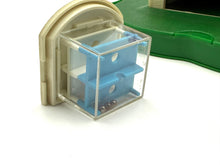 Load image into Gallery viewer, Detail close-up of a blue transparent toy block with small holes