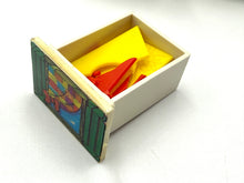 Load image into Gallery viewer, Detail of a drawer filled with colorful items.