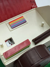 Load image into Gallery viewer, Open art supplies box displaying colorful inserts in red, cream, and brown on a white background.