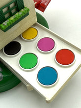 Load image into Gallery viewer, Compact paint palette with six color wells in black, pink, green, and red on a white background.
