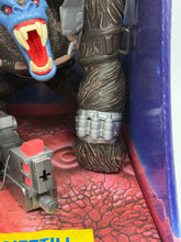 Load image into Gallery viewer, Detail view of Gormongus action figure arm featuring a robotic arm and weapon accessory.
