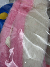 Load image into Gallery viewer, Close-up of colorful fabric pieces wrapped in plastic.