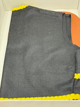 Load image into Gallery viewer, Detail view of colorful fabric components from the Pinocchio costume