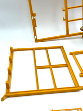 Carica l'immagine nel visualizzatore di Gallery, Mattel Sunshine Family Farm detail close-up of yellow painting tools with a grid pattern on the paint tray.