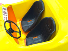 Load image into Gallery viewer, Detail view of yellow and black Barbie buggy seats with orange accents.