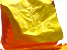 Load image into Gallery viewer, Detail view of the yellow toy cover with a wrinkled texture.