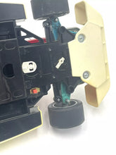 Load image into Gallery viewer, Detail close-up of the black toy car featuring rear wing and visible wheels.