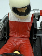 Load image into Gallery viewer, Detail close-up of the racing driver figure in red, white, and black racing suit.