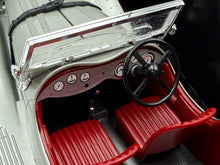 Load image into Gallery viewer, Interior detail of BBurago Jaguar SS 100 (1937) featuring red seats and dashboard controls