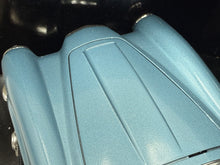 Load image into Gallery viewer, Detail close-up of the blue surface showcasing its smooth texture and curved shape.