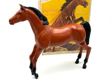 Load image into Gallery viewer, Close-up detail of the plastic horse toy highlighting its shiny finish