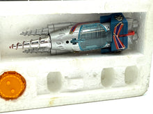 Carica l'immagine nel visualizzatore di Gallery, Detail view of the orange and gray toy figure with included accessories.