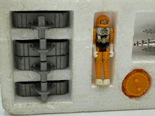 Carica l'immagine nel visualizzatore di Gallery, Close-up detail of the blue and silver toy rocket with packaging.