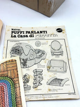 Carica l'immagine nel visualizzatore di Gallery, Detail of game components featuring wooden pieces in a circular design