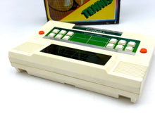 Load image into Gallery viewer, Side view of vintage gaming console highlighting control buttons and screen display.