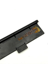 Carica l'immagine nel visualizzatore di Gallery, Close-up detail of a black plastic component from the Tomy game.