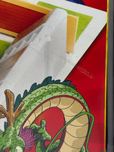 Carica l'immagine nel visualizzatore di Gallery, Game components featuring dragon illustration and game pieces.