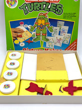 Load image into Gallery viewer, Vintage TMNT Playstuff contents showing puzzle board and game pieces.