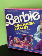 Carica l'immagine nel visualizzatore di Gallery, Mattel Barbie Suncharm Chalet packaging side view featuring hair styling accessories.