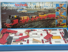 Load image into Gallery viewer, Fischertechnik Bau-Spiel-Bahn Train Playset box showcasing detailed layout and train graphics.