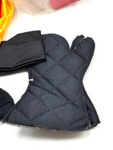 Load image into Gallery viewer, Close-up detail of black gloves with a quilted texture and finger design.