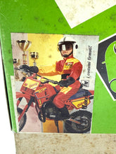 Load image into Gallery viewer, Close-up detail of the motocross costume illustration showing a rider in red, yellow, and black.