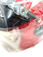 Load image into Gallery viewer, Detail close-up of a red and black KTM-style helmet showing vent holes.